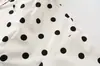Al por mayor Primavera 2026 Nuevo Estilo Europeo y Americano Abrigo de Moda para Mujer con Puntos de Polka y Mangas Largas de Cuello Alto 26124