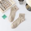 Nuevos calcetines de hombre para primavera y verano 2025 bordado de letras casual algodón color liso calcetines hombre
