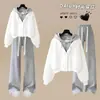 Versátil conjunto de moda estilo coreano estilo universitario chaqueta con capucha de dos piezas falsas y pantalones casuales de pierna recta para primavera y otoño