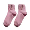 Calcetines navideños transfronterizos para mujer, calcetines de media pantorrilla para otoño e invierno, bordado de dibujos animados en colores caramelo, absorbentes de sudor, resistentes al olor, calcetines de algodón de color liso al por mayor
