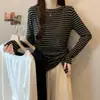 Camiseta de rayas irregulares para mujer talla grande, otoño 2026, nuevo diseño para ceñir la cintura y crear un efecto adelgazante, top de manga larga, prenda base