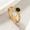 Anillo de acero de titanio de corte de estilo de lujo ligero transfronterizo, diseño de nicho, anillo de concha blanco y negro con doble fila de diamantes, joyería de acero inoxidable