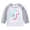 TikTok Primavera e Outono Camiseta de Algodão Infantil Ajustada ao Corpo Gola Redonda Base Manga Longa Top para Meninos e Meninas Camiseta de Bebê