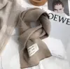 Versión coreana de la nueva bufanda de lana tejida de invierno para mujer, bufanda cálida gruesa de color liso, bufanda para estudiante, fabricantes al por mayor