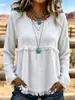 Blusa longa de manga comprida, estilo boho europeu e americano, com franjas, textura e amassada, gola redonda, corte solto e ombros caídos.