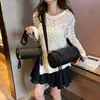 Bolsa cilíndrica de fio bordado romboidal feminina design de nicho nova moda versátil bolsa baguette Amazon bolsa de ombro transversal