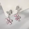 Venta Caliente Aretes Pequeños Frescos y Dulces de Zirconia Rosa Flor de Mariposa Lujo Ligero Gama Alta Versátiles de Temperamento Venta al por Mayor