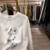 Camiseta holgada de manga larga para mujer estilo coreano para otoño e invierno, hecha de seda de leche con acabado doblemente cepillado, top de longitud media estilo ins para mujer, venta al por mayor transfronteriza