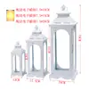 Estilo europeo hierro retro romántico adornos de candelabro lámpara de viento a prueba de viento de pie soporte para velas accesorios de boda linterna guía de camino