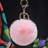 Al por mayor en stock Bola de pelo de imitación de conejo Rex de 8 cm llavero colgante lindo para mujer bolso de coche teléfono móvil colgante de felpa