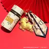 Colección Año Nuevo del Cordero: Colgante de Bolsa de Oveja Pequeña con Llavero de Bolso Cubo Estampado, Adorno de Bolsa de Almacenamiento Mini al por Mayor