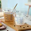 Taza medidora de vidrio resistente a altas temperaturas al por mayor del fabricante con asa para hornear en la cocina, taza medidora de vidrio de borosilicato de doble escala para pedidos