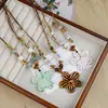 Artículos de cerámica de Jingdezhen nuevos, culturales y creativos, de gran venta, collares de cerámica de Jingdezhen, accesorios florales de moda al por mayor, productos artísticos de alta gama de estilo chino
