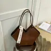 Bolso de hombro tejido con patrón transfronterizo para mujer, nuevo bolso de hombro de diseño de nicho de moda otoño e invierno 2026, bolso de mano popular
