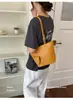 Bolsa Saco Textura Simples Retro Moda Bolsa Casual de Nicho Mochila para Mulheres Mãe Nova Bolsa de Ombro Único Transversal Tendência