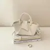 Bolso de mano transfronterizo para mujer 2026 nuevo de alta gama simple versátil plisado de hombro cruzado bolso cubo para ir al trabajo