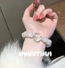 Las capas superpuestas se ven más hermosas. Pulsera Diosa Flor de Lazo de Cristal Rosa Natural, Nuevo Estilo Chino Pulsera Tesoro Flor de Rosa Cristal Blanco