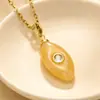Bestseller transfronterizo de Amazon: Colgante de imitación de piedra natural con ojo de circonita y diseño de gota de agua, con delicados adornos de circonita, un collar moderno y único