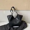 Bolso tipo cesta de mercado de moda estilo coreano 2025 nuevo versátil con patrón de lichi bolso de mano de alta gama de un solo hombro cruzado