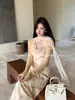Xiu Xixi 2026 Primavera Elegante Vestido de Tirantes con Cuello de Lazo Oscilante Estampado Puro Deseo Vestido de Vacaciones para Mujer 88520
