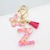 Venta Caliente Transfronteriza a-z Resina Letra Inglesa Lentejuelas Llavero Mariposa Rosa Borla Colgante Colgador de Mochila Mujeres