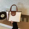 Bolso Casual de Gran Capacidad para Mujer 2025 Nuevo Estilo Coreano Color Contrastante Bolso de Hombro Cruzado Bolso de Mano Tote Simple para Ropa de Trabajo
