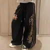 Pantalones de chándal holgados casuales de estilo americano de moda para street dance con graffiti de espinas y estampados grandes en ambos lados, pantalones de baile casuales hip-hop