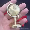 Latão 100 Milhões Pequeno Giratório de Metas Escritório Casa Criativo Alívio de Estresse Presente Artesanato em Metal Ornamento de Mesa Atacado