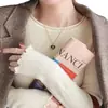 Suéter base para mujer para primavera y otoño 2025, nuevo y elegante top de punto de cuello redondo de alta gama con mangas largas