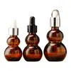 Botella de vidrio para té con esencia de aceite, botella creativa con forma de doble calabaza para envasado de cosméticos, botella de muestra pequeña para esencia portátil de viaje al por mayor