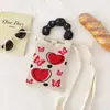 Nuevo diseño de nicho, lindo mini bolso de punto para teléfono móvil con dibujos animados, bolso bandolera pequeño y portátil para uso diario, bolso cuadrado pequeño.