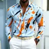 Nueva camisa de manga larga para hombre con base azul y estampado de salpicaduras naranja-amarillas, diseño audaz y llamativo, versátil para ir al trabajo