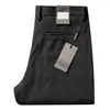 Pantalones de lana gruesa elástica para hombre de otoño e invierno 2023 pantalones de lana cepillada de alta gama rectos holgados de negocios casual