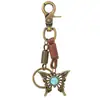 Llavero vintage de metal con forma de mariposa y charm de cuero envejecido, un accesorio creativo para coches y bolsos, un producto popular transfronterizo