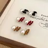 Pendientes de Perla Cruzados Dobles C Vintage Otoño e Invierno para Mujer 2024 Nuevos Pendientes Elegantes de Alta Gama Pendientes Únicos