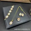 Nuevo Milenio Corte Azul Cristal Luminoso Juego de Joyería Sentido del Diseño Adornos Populares Collar Anillo Pulsera Personalidad Fuente