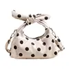 Bolso de lunares de nicho súper popular para mujer, nuevo estilo coreano 2026, bolso versátil y elegante para hombro y bandolera para ir al trabajo y viajar