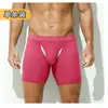 Roupa Íntima Masculina Bolsa Grande Boxer Esportivo Anti-Assadura Perna Estendida Tamanho Grande Respirável Boxer Brief para Corrida Cueca Masculina de Comprimento Médio