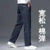 Jeans escuro de alta qualidade para outono masculino, calça longa de corte reto solta, novo estilo 2026, luxo leve, calça versátil