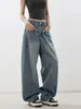 Jeans azules estilo americano con dobladillo curvo para mujer, otoño e invierno 2026, pantalones holgados de pierna ancha con un diseño único, pantalones de pierna ancha de tiro alto, nuevo estilo
