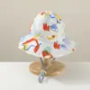 Sombrero de pescador para bebé al por mayor moda estampado pequeño fresco sombrero para el sol dos lados disponibles sombrero para niños versión coreana
