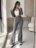 Conjunto de roupas femininas europeias e americanas para comércio exterior transfronteiriço: top cardigã curto texturizado e calça flare de cintura alta que valoriza a silhueta, conjunto de duas peças para o dia a dia