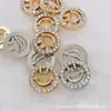 Botón de metal de alta gama hebilla de camisa cara sonriente hueca hebilla decorativa linda hebilla de diamante para niños tridimensional exquisita moda para niñas
