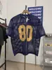 Novo Estilo Europeu e Americano Design Vazado 80 Estrelas Digitais Blusa de Tricô Solta Gola Redonda Manga Curta Esportiva Tendência Masculino e Feminino