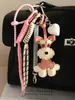 MIU Linda Bolsa de Perro Schnery PU Versátil Colgante Llavero de Coche Cuerda Trenzada de Amor Béisbol Colgante