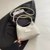 Moda Primavera 2026 Nova Bolsa de Bolinho de Massa de Nicho Casual Personalidade Bolsa de Ombro Simples Texturizada Tendência Bolsa Feminina