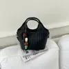 Bolso de tejido de alta gama de nicho para mujer, nuevo bolso cruzado versátil de moda 2026, bolso de mano exquisito, bolso tipo cubo
