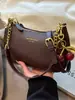 Bolso pequeño de color liso texturizado estilo coreano para mujer para otoño e invierno, nuevo modelo 2026, bolso de hombro con cadena de patrón de lichi, bolso cruzado de alta gama