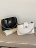 Bolso de Cadena de Rejilla de Diamantes de Gama Alta para Mujer 2026 Nuevo Bolso Cubo de Moda Diseño Elegante de Nicho Bolso de Hombro Único Cruzado