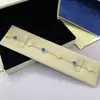 Pulsera Mini Trébol Chapada en Oro de Alta Calidad 18K con Cadena de Ágata Roja Que No Se Desvanece